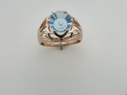 Image de Bague en or rose 10KT sertie d'un topaze bleu